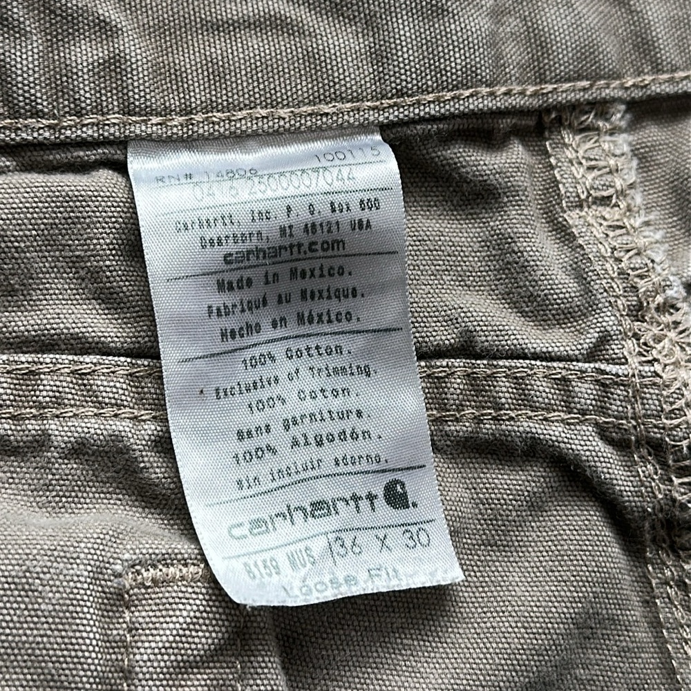 Carhartt distressed carpenter pants with some stains and holes. #10015 - Picture 3 of 11